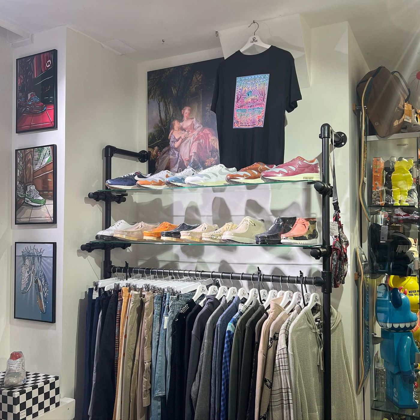 Clothing rack and artwork on the wall