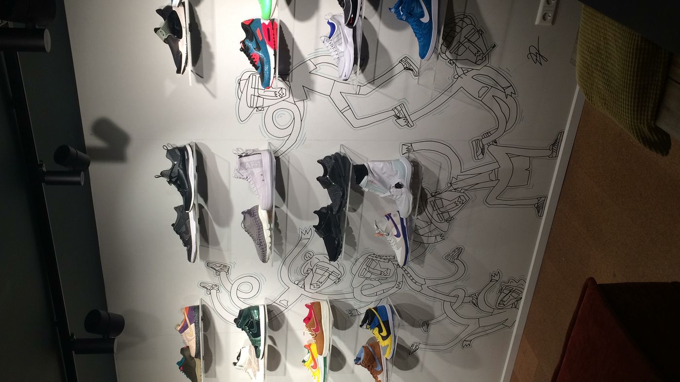 Curated sneaker wall at the Rosmarijnsteeg store